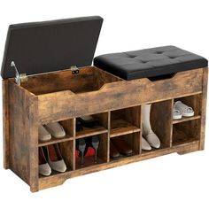 a wooden shoe box with two compartments and shoes on it's sides, open to show the inside