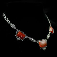 "Fine Antique Art Deco 925 Sterling + Blood Orange Carnelian + Marcasite Necklace- Authentic Jewelry of the 1920s-1930s Measurements: Chain: 16.5\" + 1\" (center pendant) Excellent antique condition w/ amazing gem translucence. Reference photos provided for you to verify condition. Disclaimer on multiple purchases: No combined shipping costs. Each items shipping cost is as stated in the listing." 1920s Necklace, Orange Carnelian, Sterling Silver Marcasite, Authentic Jewelry, Antique Art Deco, Blood Orange, Reference Photos, Classic Ring, Antique Art