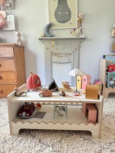 a toy table with toys on it in a child's room