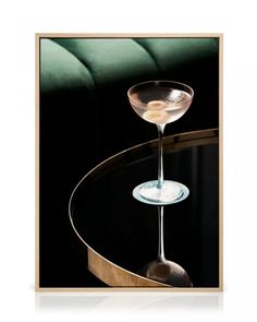 a martini glass sitting on top of a table