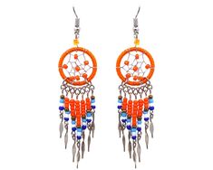 PRICES MAY VARY. Dream catcher earrings with long seed bead and alpaca silver dangles in Native American color scheme. Express your love for handcrafted arts and culture with our colorful ethnic Native American inspired collection. Dimensions: approx. 3.1" x 0.7" x 0.2" Surgical steel hooks are hypoallergenic and lightweight for a comfortable fit. Handmade in Peru. Round beaded thread dream catcher earrings with long seed bead and alpaca silver dangles in Native American inspired color combinati Dream Catcher Earrings, Native American Style, Arts And Culture, Boho Accessories, Handcrafted Art, Native American Fashion, Beaded Dangle Earrings, Earrings Long, Jewelry Boho