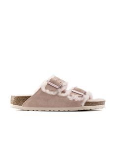 The popular BIRKENSTOCK Arizona is a classic model with two adjustable straps. Featured in genuine high-quality suede – and is now available in an extra cozy version thanks to a soft, bright genuine shearling lining on the anatomically formed cork-latex footbed and straps. These sandals are perfect for chilly, winter evenings. Birkenstock Arizona, Rose Lights, Slip On Sandal, Birkenstock, Cork, Arizona, Adjustable Straps, Sandals, High Quality