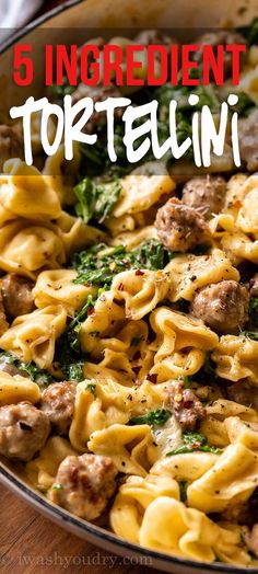 a pan filled with pasta and meat on top of a wooden table