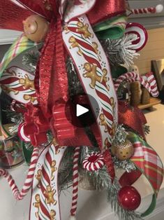 a christmas wreath with candy canes and ornaments