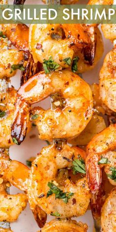 grilled shrimp on a white plate with parsley garnish and text overlay