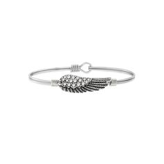 Luca + Danni's iconic, stacking bracelets are shaped to sit top of wrist so you can express the things that matter most to you. Celebrate your faith with this crystal angel wing bangle from Luca + Danni, featuring an oval design for a more comfortable fit. Luca + Danni's iconic, stacking bracelets are shaped to sit top of wrist so you can express the things that matter most to you. Celebrate your faith with this crystal angel wing bangle from Luca + Danni, featuring an oval design for a more com Casual Silver Bangle Cuff Bracelet, Casual Silver Stackable Jewelry, Casual Metal Bangle Jewelry, Silver Stackable Jewelry For Friendship, Stackable Wrap Bracelet For Friendship, Silver Casual Wrap Bracelet As Gift, Casual Silver Stackable Bracelets, Silver Casual Wrap Bracelet For Gift, Casual Stackable Bracelet Jewelry