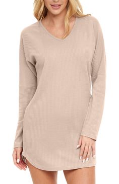 This ribbed, waffle knit nightshirt from Alexander Del Rossa, crafted for women, offers a unique blend of comfort, durability, and sophistication. The soft and lightweight fabric is expertly ribbed, yielding a premium feel that maintains its form and ribbed texture despite frequent usage. Carefully designed to resist shrinkage, this ribbed fabric has undergone extensive color testing, ensuring the hues do not bleed, thus retaining the nightshirt's pristine look. A hallmark feature of this ribbed nightshirt is the deep v-neck cut that adds a stylish edge. The design incorporates dropped shoulders, beautifully aligning with the ribbed motif, while long dolman sleeves further enhance the shirt's aesthetic appeal. The sleeves themselves are narrow and ribbed, complementing the overall structur Stretch V-neck Sleep Top, Winter V-neck Sleepwear For Lounging, Winter V-neck Sleepwear, Stretch V-neck Top For Sleep, Solid V-neck Sleep Tops, Stretch Ribbed Tops For Relaxation, Fall V-neck Sleepwear For Lounging, Comfortable V-neck Top For Lounging, Spring V-neck Sleep Tops