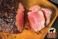 two pieces of steak on a cutting board