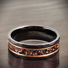 Embrace the poetic irony of Dinosaur and Space with this masterfully crafted tungsten carbide ring. A tale of Earth's primeval giants and the vastness of the universe converges on your finger, symbolizing both an end and an endless wonder. -Dino's Last Dance: The striking red dinosaur bone fossil inlay whispers tales of a world once ruled by majestic beasts. Their reign, vibrant yet fleeting, captured in every hue and pattern. -Cosmic Irony: At the heart of the design lies the shimmering silver Red Dinosaur, Dinosaur Bone Ring, Bone Ring, Dinosaur Bones, Tungsten Carbide Rings, Ring Mens, American Southwest, Last Dance, Gold Stripes