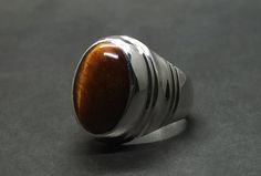 Natural Tiger's Eye Sterling Silver 925 Handmade Mens Ring Product: Ring Gemstone: Tiger's Eye Color: Brown Handmade Ring All of our Handmade Rings are pure 925 Sterling Silver with Natural Gemstones. Tiger Eye Ring, Carnelian Ring, 18k Gold Ring, Mens Ring, Eye Ring, Handmade Rings, Agate Ring, Ring Photos, Tigers Eye