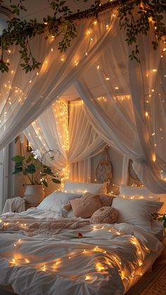 a bed with white sheets and lights on it