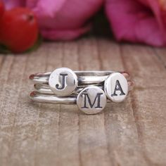 "Mix and match! Stack and spell! Say whatever you want with these stacking initial rings. Spell a child's name, stack your initials, or get one initial for each grandchild. **The price listed is for one sterling silver stacking ring but if you want more, you can change the quantity** These rings also look great stacked with our birthstone rings, find them at this listing: https://www.etsy.com/listing/192036913 ♥♥ HOW TO ORDER ♥♥ 1. FROM THE DROP DOWN BOX SELECT THE SIZE AND QUANTITY OF RINGS 2. Rings With Initials, Personalized Initial Ring, Silver Initial Ring, Initial Rings, Birthstone Stacking Rings, Mothers Ring, Diamond Wedding Jewelry, Family Rings, Sterling Silver Stacking Rings