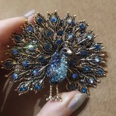 Exciting news for our peacock enthusiasts! Unveiling our latest treasure, the Sparkling Rhinestone Peacock Brooch – a mesmerizing embodiment of grace and elegance. Original and stylish, this beautiful peacock brooch is tailored for aficionados of peacock-inspired accessories! An elegant shimmering jewel that captures the allure of a peacock's majestic beauty. Its iridescence comes to life through meticulously arranged glistening rhinestones that shimmer with your every move ~ We love how the int Peacock Brooch, Boheme Chic, Sequin Clutch, Beautiful Peacock, Cute Hedgehog, Vintage Party, Boho Festival, Watch Gifts, Exciting News