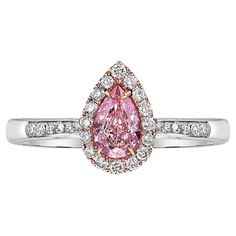 0.50ct center pear shape SI1 clarity GIA certified Very Light Pinkish Brown set with Pink enamel underneath to give it a very pink look Set in 18k white gold Exceptionally sweet color Designed for amazing value Making Extraordinary Attainable with Rare Colors Pink Pear-shaped Ring For Formal Occasions, Pear Shaped Pink Ring For Formal Occasions, Pink Pear-shaped Formal Rings, Formal Pink Pear-shaped Rings, Pink Pear-shaped Rings With Diamond Accents, Pink Pear-shaped Diamond Ring With Halo Setting, Pink Teardrop Halo Setting Ring, Pink Pear-shaped Halo Diamond Ring, Pink Pear-shaped Diamond Ring With Prong Setting