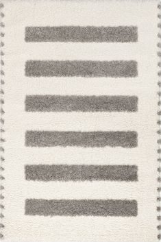 a white rug with grey stripes on it