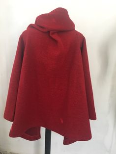 "This is a new wool wrap cardigan.Looking fabulous either with the belt,wish is from the same material or without it.It will best fit for size S/M The colour is black .It is 100%wool and is really warm,would recommend dry cleaning for washing it.It does not have lining,it is like a big cosy shawl with sleeves.Has two discret buttons.An outstanding piese of clothing for the upcoming season. SIZE CHART SIZE S - US 6, UK 8, EU 36 bust: bust around 34.5\"/90cm Waist: waist around 27.5\"/70cm Hips: h Long Sleeve Wool Cape For Fall, Oversized Wrap Outerwear For Winter, Red Wool Cardigan For Fall, Wool Wrap Outerwear For Fall, Cozy Wool Wraps For Fall, Red Cape Outerwear For Fall, Red Cape For Fall Outerwear, Oversized Red Cape For Fall, One Size Red Knitted Outerwear