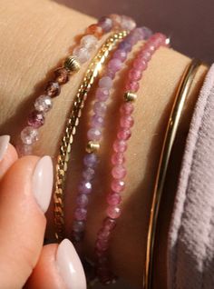 Named for how well these play (and stack) with others, these gemstone stretchy bracelets are handmade in Vancouver. Pink Tourmaline Bracelet: 3mm beads, 3mm 14k gold-filled bead detail Purple Sapphire Bracelet: 3mm beads, 3mm 14k gold-filled bead detail Spinel Bracelet: 4mm beads, 4mm 14k gold-filled bead detail Details Each piece of Leah Alexandra jewellery is handmade in her Vancouver beachside studio. Only the finest materials are used, including 14k gold fill, sterling silver, and carefully