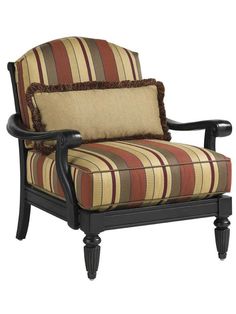 an upholstered chair with striped fabric on the armrests and back cushions