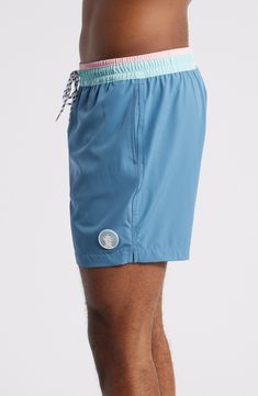 These classic swim trunks are made with quick-drying four-way-stretch fabric and built-in mesh compression shorts for comfort wherever the waves take you. 5 1/2" inseam; 23" leg opening; 11 1/2" front rise; 14 1/2" back rise (size Medium) Elastic/drawstring waist Side-seam pockets with mesh lining; back zip pocket Built-in mesh compression shorts UPF 50+ sun protection Four-way-stretch fabric 92% polyester, 8% spandex Machine wash, tumble dry Imported Compression Shorts, Swim Trunks, Dusty Blue, Upf 50, Sun Protection, Drawstring Waist, Stretch Fabric, Zip Pockets, Built In