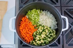 chopped vegetables are in a pot on the stove