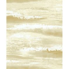 a beige and white wallpaper with waves in the ocean on it's side