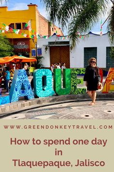 a woman is standing in front of the letters that spell out how to spend one day in taquepaque, jalisco