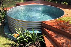 a hot tub sitting on top of a wooden deck