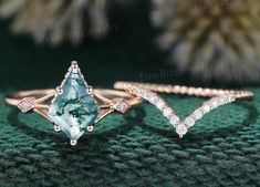 three different types of engagement rings with green and white stones on top of each other