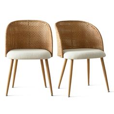 two chairs with wooden legs and white cushions, one is made out of rattan