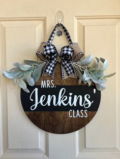 a wooden sign hanging on the side of a door that says mrs jenkins class