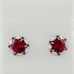 Karat: .925 Sterling Silver Gemstone : 2 Lab Created Rubies Total Ct Weight : 2.36 Carats Ruby Grades, Hue . . . Red Tone . . . Medium Saturation . . . Vivid Cut . . . Excellent No Inclusions Or Flaws 12 Lab Rubies - 0.01 Carats Each 12 Lab Created White Sapphires - 0.08 Ct Each Style : Stud Closure : Screw Back Shape : Oval & Round Setting : Prong Dimensions : 9 Mm (0.35") - Each Earring Measurements Sapphire Stud Earrings, Red Tone, Sapphire Earrings Studs, Sapphire Studs, Pumpkin Earrings, Hammered Gold, Colorful Earrings, Genuine Turquoise, Fine Jewellery Earrings