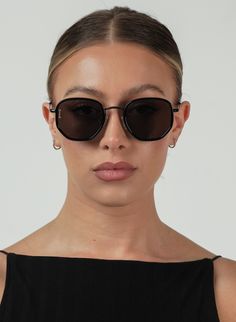 HEXAGONAL METAL SUNGLASSES IN BLACK PRODUCT DETAILS Frame Shape: Hexagonal Metal Frame Color: Black with a Metal Frame Lens Color: Smoke, Lens Category 3 100% UV Protection Comes with a Protective Vegan Pouch SIZE MM INCHES FRAME WIDTH 145MM 5.6" FRAME HEIGHT 46.4MM 1.8" NOSE GAP 23MM 0.9" Sleek Black Sunglasses With Metal Frame, Black Metal Frame Sunglasses For Beach, Trendy Black Metal Frame Sunglasses, Trendy Black Sunglasses With Metal Frame, Casual Black Sunglasses With Metal Frame, Metal Sunglasses, Black Metal Frame, Black Metal, Uv Protection