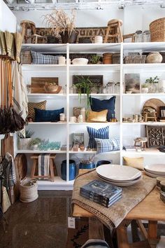 a room filled with lots of shelves and furniture