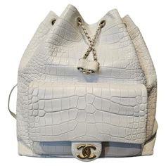 Beautiful croc embossed backpack from 2019 collection. Large size. Good backpack for day to day. Overall shows gentle signs of wear throughout, with light rubbing on the corners and tarnishing on the hardware. The holo sticker has detached but is kept attached to the authenticity card. Comes with its holo attached to the card and dust bag. Chanel Luggage, Chanel 2019, Chanel White, Day To Day, Cool Backpacks, To Day, Backpack Purse, Fashion Handbags, Embossed Leather