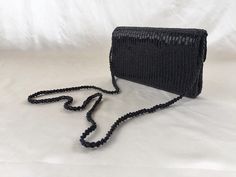 "Black Beaded Cross Bag, Vintage Beaded Purse, Vintage Deco Flapper Bag, Vintage Beaded Evening Bag, Vintage Fashion, Sustainable Fashion Measurements: 8.5\" x 4.5\" 1.5\" thickness Condition: In VERY GOOD vintage condition. Three beads missing on back of purse but other than that, the purse is clean and in excellent condition. ★ Please note that all packages are being shipped from Japan. Delivery options and speed differ from country to country. If you have questions about shipment, feel free t Unique Pearl Earrings, Beaded Evening Bags, Faux Pearl Earrings, Purse Vintage, Beaded Cross, Cross Bag, Beaded Purses, Unique Ceramics, Bag Vintage