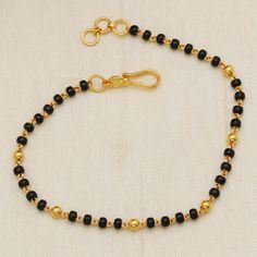 22kt Yellow Gold Bracelet Party Festive Wear Wedding Jewelry,  Metal is Real Gold Purity is 22kt Weight - 3.86 grams approx Length - 7 inches approx (please contact us for different size) Width - 3 mm approx  Please feel free to ask if you have any query. Black Pusalu Chain, Black Beads Bracelet Gold, Gold Black Beads, Gold Jewelry Bracelet, Black Beads Bracelet, Black Bead Bracelet, Bracelet Party, Gold Jewels Design, Antique Necklaces Design