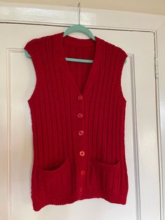 Gorgeous vintage hand knitted red gilet waistcoat sleeveless textured cardigan  Button front fastening  size S Please take note of the measurements  18.5" armpit to armpit across the front  26.5" long from shoulder to hem  Would probably best fit a size U.K. 10 There is some stretch  In good vintage condition I only sell vintage items that are in great pre loved condition. Most items have been chosen and sourced personally by me and collected over the years. I always try to describe any flaws, f Fitted Winter Sweater Vest, Fitted Sweater Vest For Winter, Fitted Knit Vest For Winter, Fitted Knit Sweater Vest For Winter, Chunky Knit Sleeveless Winter Vest, Chunky Knit Sleeveless Vest For Winter, Winter Chunky Knit Sleeveless Vest, Retro Sleeveless Sweater For Winter, Knitted Vest For Winter