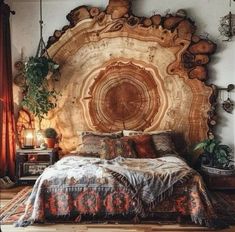 a bed made out of wood with an intricate headboard