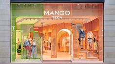 the mannequins are displayed in front of the storefront window with neon colors