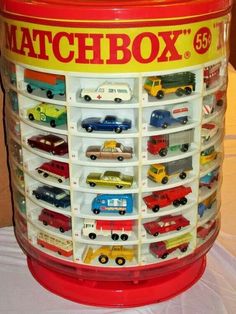 a red matchbox bucket filled with lots of toy cars