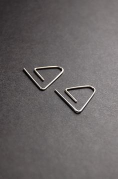 Dainty open triangle hoop style earrings made with your choice of 14k gold filled, 14k rose gold filled, sterling silver, or argentium silver wire. They are lightweight, waterproof, and suitable for sensitive skin.   𝑔𝑜𝓁𝒹 𝒻𝒾𝓁𝓁 14k gold fill jewelry is an excellent choice for those seeking both quality and affordability. Crafted by bonding a thick layer of 14-karat gold to a base metal core, it offers the luxurious look of solid gold without the high price tag. This makes it a fantastic o Minimalist Triangle Hoop Earrings As Gift, Modern Cartilage Earrings With Ear Wire, Minimalist Triangle Jewelry For Pierced Ears, Minimalist Triangle Jewelry, Minimalist Nickel-free Triangle Earrings, Minimalist Triangle Nickel-free Earrings, Minimalist Nickel-free Drop Cartilage Earrings, Minimalist Paperclip Earrings, Silver Triangle Minimalist Earrings