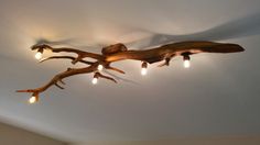 a wooden light fixture hanging from the ceiling