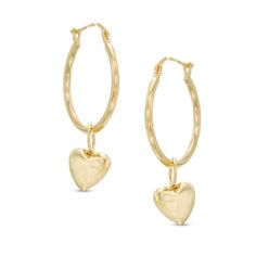 Sweet and versatile, these dainty hoops are a fun look she'll love. Crafted in 14K gold, each hoop earring features a puffed heart charm that dangles playfully below. Polished to a bright shine, these enchanting hoop earrings secure comfortably with latch backs. Small Hoop Yellow Gold Earrings For Valentine's Day, Small Hoop Earrings With Heart Charm For Anniversary, Anniversary Small Hoop Earrings With Heart Charm, 14k Gold Hoop Earrings With Heart Charm, Valentine's Day Tarnish Resistant Dangle Hoop Earrings, Valentine's Day Dangle Hoop Earrings Tarnish Resistant, Valentine's Day Tarnish-resistant Dangle Hoop Earrings, 14k Gold Filled Hoop Earrings With Dangling Charms, Yellow Gold Heart Charm Hoop Earrings