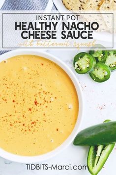 a bowl of healthy nacho cheese sauce with jalapenos on the side