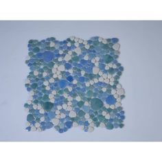 blue and white glass pebbles arranged in the shape of a square