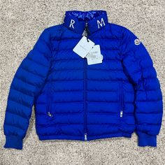 Moncler Paris Akio Jacket Blue Size 3 Luxury Blue Hooded Outerwear, Luxury Blue Outerwear For Spring, Designer Blue Outerwear With Padded Collar, Luxury Blue Winter Puffer Jacket, Luxury Blue Puffer Jacket For Winter, Designer Blue Outerwear For Fall, Luxury Blue Puffer Jacket, Designer Blue Outerwear For Spring, Moncler Jacket Mens