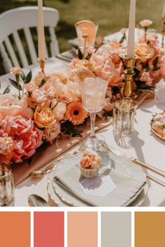 the table is set with flowers and candles