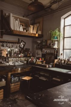 a room filled with lots of clutter next to a wooden shelf full of bottles