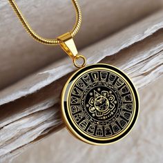 "This Aztec Mayan Calendar Necklace Is the Perfect Gift for all those Mayan lovers, Whether for Yourself or a Loved One.  Explore all our Witchcraft jewelry here: https://www.etsy.com/in-en/shop/SymbolicPresent?ref=seller-platform-mcnav§ion_id=22613465 ➜ Our jewelry is made of high-quality surgical steel with a shatterproof liquid glass coating and an 18k gold finish option. ➜ Engrave onto the back of the Aztec Mayan Calendar pendant your loved one's name, your wedding date, an anniversary, or a Spiritual Stainless Steel Jewelry, Spiritual Stainless Steel Jewelry Round Shape, Symbolic Stainless Steel Medallion Jewelry, Spiritual Stainless Steel Locket Jewelry, Spiritual Stainless Steel Necklaces For Anniversary, Spiritual Stainless Steel Necklace For Anniversary, Stainless Steel Amulet Necklace For Gift, Handmade Symbolic Stainless Steel Necklace, Stainless Steel Round Amulet Jewelry