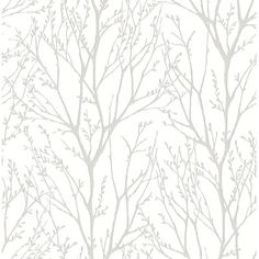 a white and beige wallpaper with branches on it